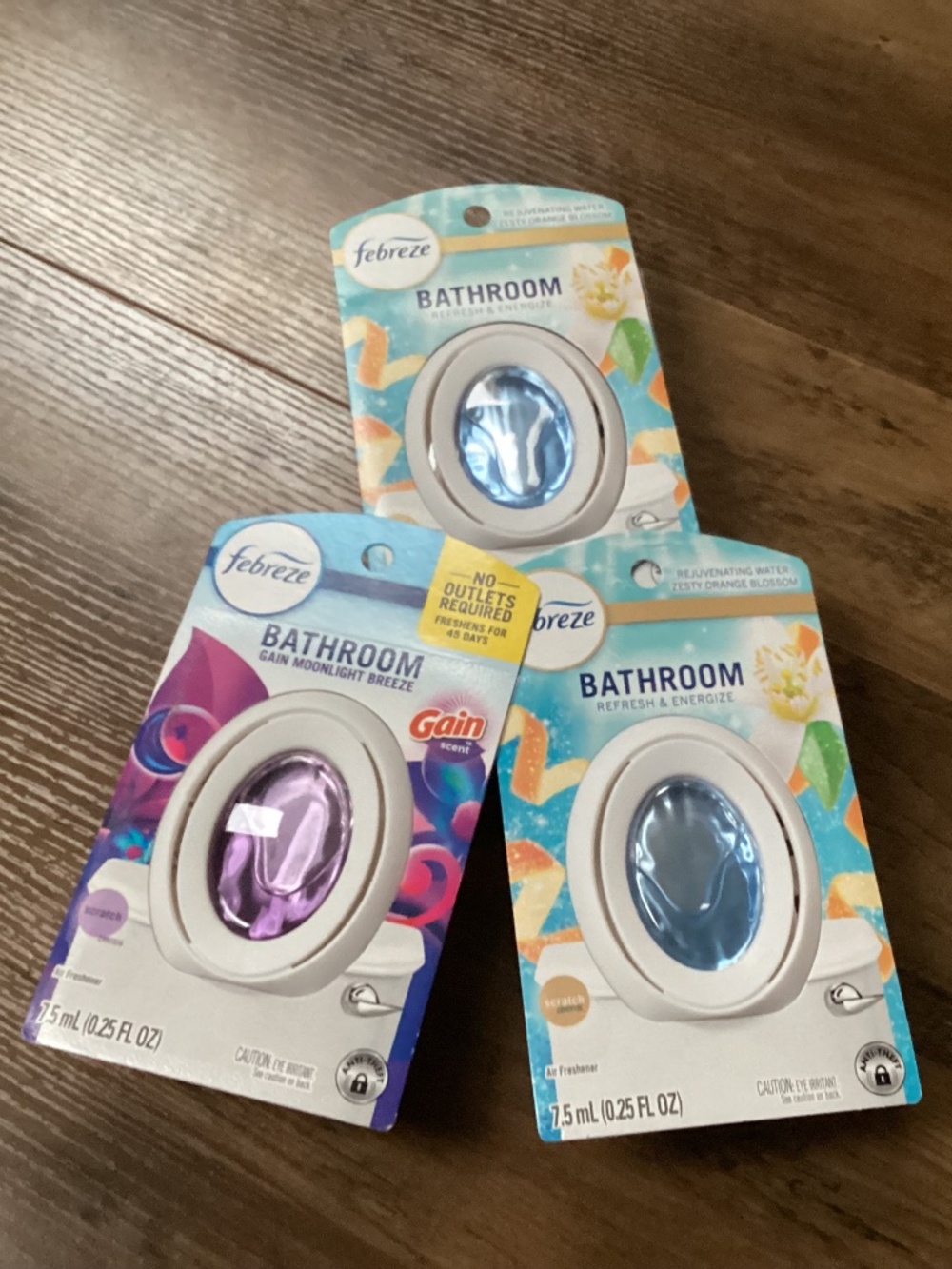 Febreze bathroom air fresheners in a three-pack lot New